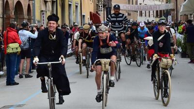 Cyclists ride during L'Eroica Sud, a retro cycling event in Buonconvento, near Siena. Competitors wearing vintage cycling jerseys and riding vintage bicycles took part in L'Eroica Sud, riding through the 'Strade Bianche', the gravel roads of the Chianti area of Tuscany. Giuseppe Cacace / AFP Photo