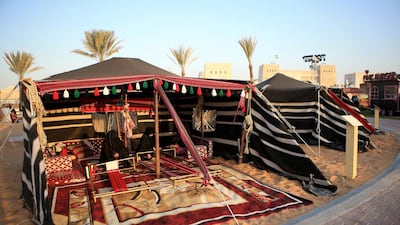 Women sit at the stalls in the UAE pavilion. Ravindranath K / The National