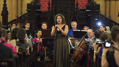 Lubana Al Quntar, a Syrian opera singer who was granted asylum in the United States, sings with the Refugee Orchestra Project on World Refugee Day in New York on June 20, 2016. Dom Emmert / AFP