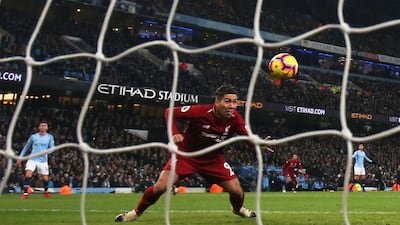Roberto Firmino scores their first goal. Action Images via Reuters