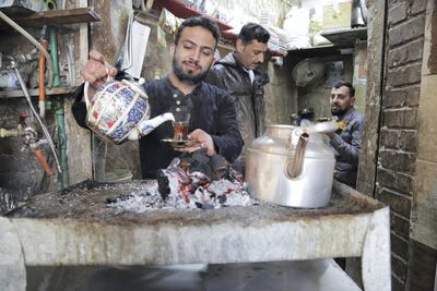 Hussein's tea stall is the last stop before pilgrims enter the shrine. His decorative porcelain teapots are imported from Iran and he makes sure to keep them piping hot for the chattering customers who flock to his hearth needing a boost of energy. Leila Molana-Allen for The National