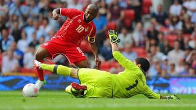 Ismail Matar of the UAE rounds Martin Campana of Uruguay before scoring to make it 1-0. Getty Images