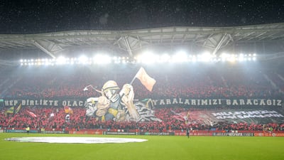 Trabzonspor supporters perform a choreography in support for the earthquake victims. EPA
