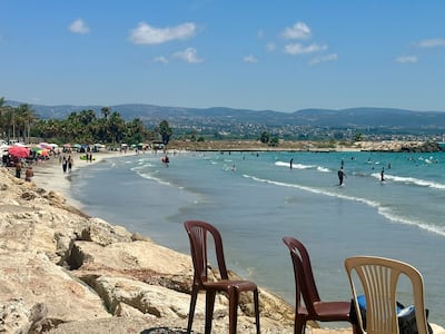Beachgoers enjoy the Mediterranean coast in Tyre during Lebanon’s fragile ceasefire, as families cautiously return to the shoreline after months of conflict despite the continued risk of renewed violence. Nada Maucourant Atallah / The National