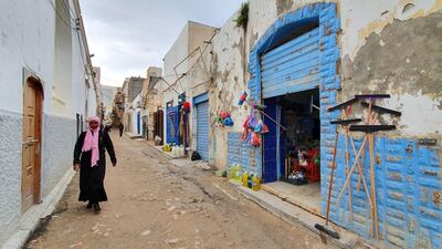 A woman walks in Libya's capital Tripoli, controlled by the UN-recognised Government of National Accord (GNA). Residents of Libya's capital have received news of a ceasefire with a mix of relief and scepticism after more than nine months of deadly fighting on the edges of Tripoli. AFP