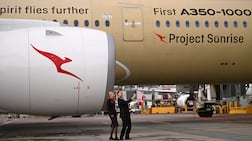 Qantas staff members take a selfie with an Airbus A350-1000ULR, developed for Qantas' long-haul Project Sunrise. EPA