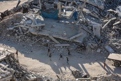 Children play football in the ruins of Gaza. AFP