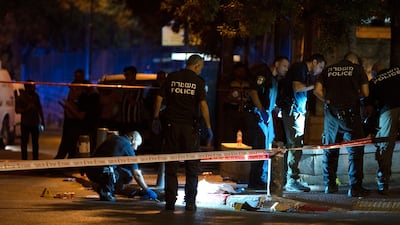 Police at work behind a cordon. AP