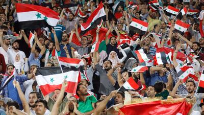 Fans cheer Syria on in Iran. Abedin Taherkenareh / EPA