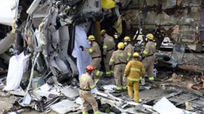Rescue crews continue to search for survivors at the site of a train crash Sept 13 2008 in Chatsworth, California.