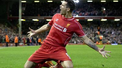 Liverpool's Dejan Lovren celebrates after scoring the winner in added time against Swansea City in the League Cup on Tuesday. Oli Scarff / AFP / October 28, 2014