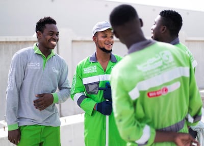 Lucky with his colleagues. Reem Mohammed / The National