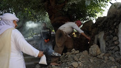 Iraqi Yezidis visit the Temple of Lalish, in a valley near the Kurdish city of Dohuk about 430km northwest of the capital Baghdad, on July 16, 2019. AFP