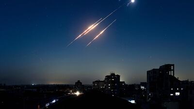 Iranian missiles launched at Israel seen from the Nuseirat refugee camp in the besieged Gaza Strip. AFP