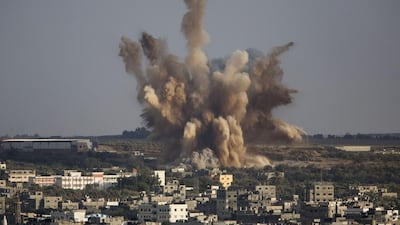 Smoke rises in Gaza City after an Israeli airstrike. Dusan Vranic / AP Photo