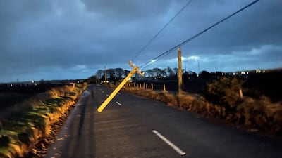 High winds brought down a telegraph pole in Co Antrim, Northern Ireland. PA
