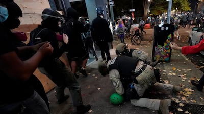 Oregon State Police arrest a protester in Portland, Oregon. AP Photo