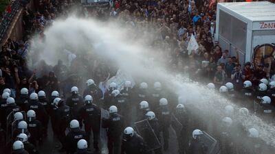 German riot police use water cannons against protesters during the demonstrations during the G20 summit in Hamburg, Germany