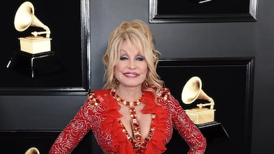 The legendary Dolly Parton stuck to her personal style, with a dress that's most likely custom made for her. Photo: AP