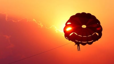 An Indian youth enjoys parasailing during the month-long 'Bhoj Adventure Festival' in Bhopal. Sanjeev Gupta / EPA