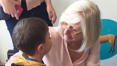 Group leader Barbara Evans with one of the Syrian children.