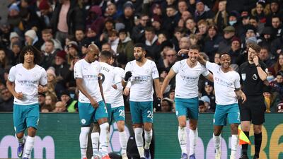 Manchester City players celebrate with Ruben Dias after his opening goal. Getty Images