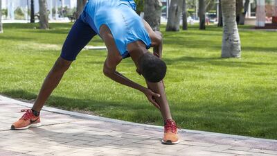 Abdulsalam Farah stretches before training.