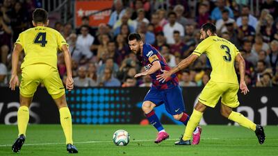 Barcelona's Argentine forward Lionel Messi vies with Villarreal's Spanish defender Raul Albiol. AFP