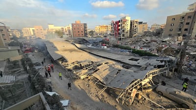 First responders gather at the site of an Israeli strike near a hospital in the southern Lebanese city of Tyre. AFP