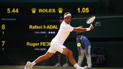 LONDON, ENGLAND - JULY 12: Roger Federer of Switzerland stretches to play a backhand in his Men's Singles semi-final match against Rafael Nadal of Spain during Day eleven of The Championships - Wimbledon 2019 at All England Lawn Tennis and Croquet Club on July 12, 2019 in London, England. (Photo by Clive Brunskill/Getty Images)