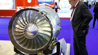 A visitor looks at a turbine display. Pierre Albouy / Reuters