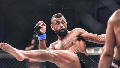 Brave Combat Federation 27 at the Mubadala Arena. Bantamweight: (L-R) Jalal Al Daaja (JOR) gives a roundhouse kick during his bout against Tariq Ismail (CAN). Victor Besa / The National