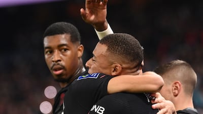 Mbappe celebrates with French defender Presnel Kimpembe. AFP