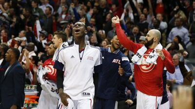 Atlanta Hawks guard Dennis Schroder, front, reacts after an Atlanta basket late in the second half against the Portland Trail Blazers. Atlanta won 105-99. John Bazemore / AP