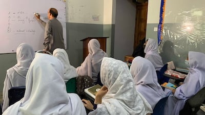 Iqbal Hussain, a member of the faculty at Khushal School and College in Pakistan's Swat region where Malala Youafzai was a pupil, teaches science to 10th grade pupils. All photos: Tariq Ullah for The National