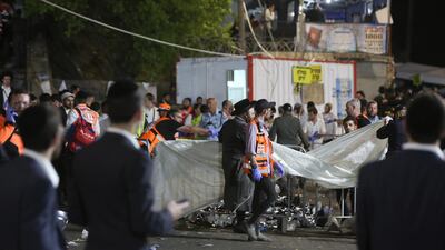 Israeli security officials and rescuers inspect bodies of dozens of ultra-Orthodox Jews who died during Lag BaOmer celebrations at Mount Meron, Israel. EPA