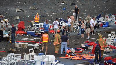 September 16, 2011: A crowd gathers around debris after a P-51 Mustang airplane crashed at the Reno Air show. (AP Photo/Grass Valley Union, Tim O'Brien)