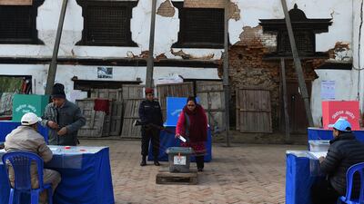 A Nepali woman votes in provincial and national parliament elections at a polling station in Kathmandu. Prakash Mathema / AFP Photo