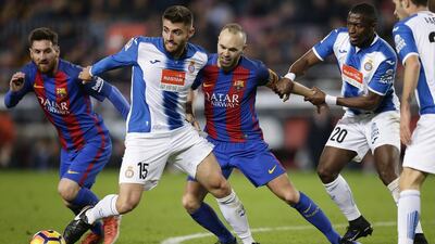 Andres Iniesta, centre, is second only to Xavi Hernandez as Barcelona's most capped player. Manu Fernandez / AP Photo