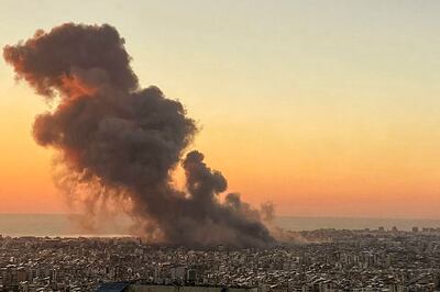 Smoke rises above Beirut's southern suburbs during an Israeli strike on September 27. AFP