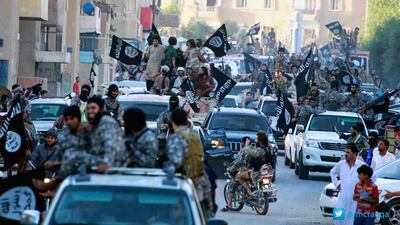 ISIL fighters in their Syrian stronghold of Raqqa, in a photo released by the extremists’ Raqqa Media Center on June 30, 2014. Raqqa Media Center / AP Photo