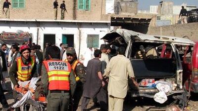 escue workers rush injured victims of a suicide bomb attack to a hospital in Kohat, Pakistan.