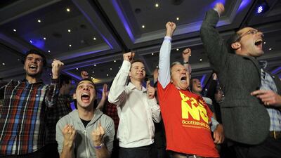 Pro-union supporters react as Scottish independence referendum results come in at a Better Together event in Glasgow. Scottish voters decided to say in the United Kingdom. Amndy Buchanan / AFP Photo