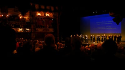 Singers perform the Ukrainian national anthem to a standing ovation. Reuters