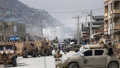 Afghan security forces inspect near the site of an attack in Kabul, Afghanistan. REUTERS