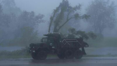 A truck is seen in heavy winds and rain from Hurricane Ida in Bourg. AFP