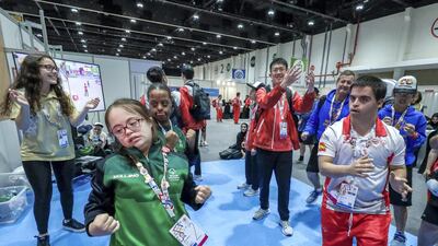 At the Healthy Athletes area at ADNEC. This is an area where the special athletes may get free medical check ups and enjoy other health activities. Athletes dance to the video at the Physical Activity Area.