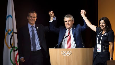 From left to right: Mayor of Los Angeles Eric Garcetti, International Olympic Committee President Thomas Bach and Paris Mayoress Anne Hidalgo pose together during the International Olympic Committee Extraordinary Session in Lausanne, Switzerland. Jean-Christophe Bott / EPA