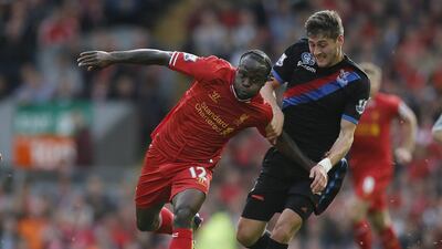 Liverpool's Victor Moses, left, set a new standard for mind-boggling misses on Saturday, contriving to put the ball over the bar from close range despite facing an open goal. Phil Noble / Reuters
