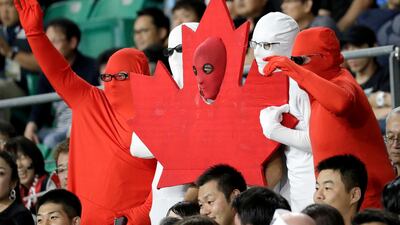 Canadian fans wave ahead of the Rugby World Cup Pool B game at Oita Stadium between New Zealand and Canada in Oita, Japan. AP Photo